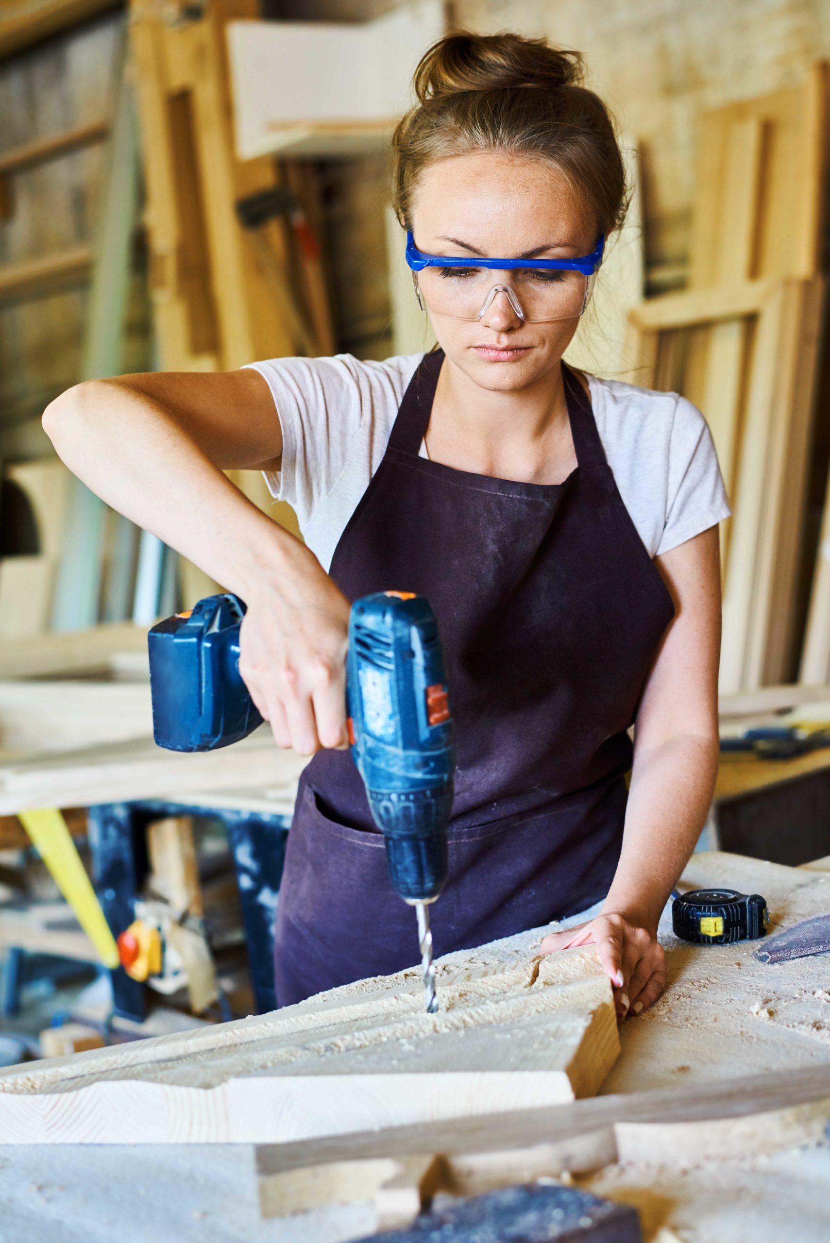 Female Carpenter Working in Shop